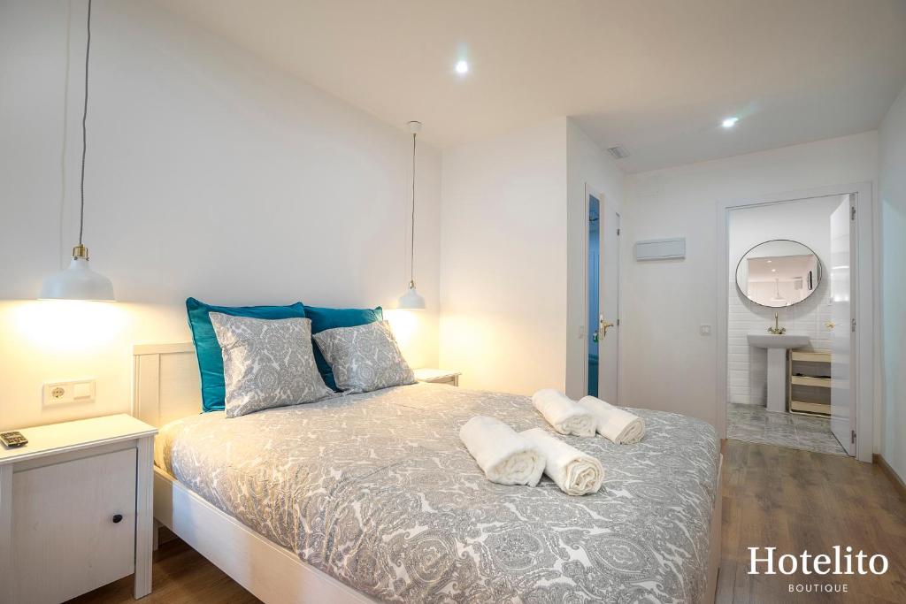 Postel nebo postele na pokoji v ubytování Hotelito Boutique Mercat
