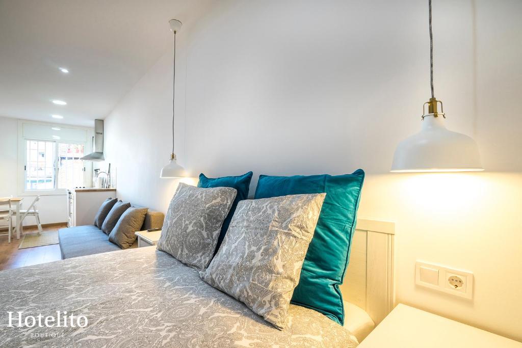 Postel nebo postele na pokoji v ubytování Hotelito Boutique Mercat