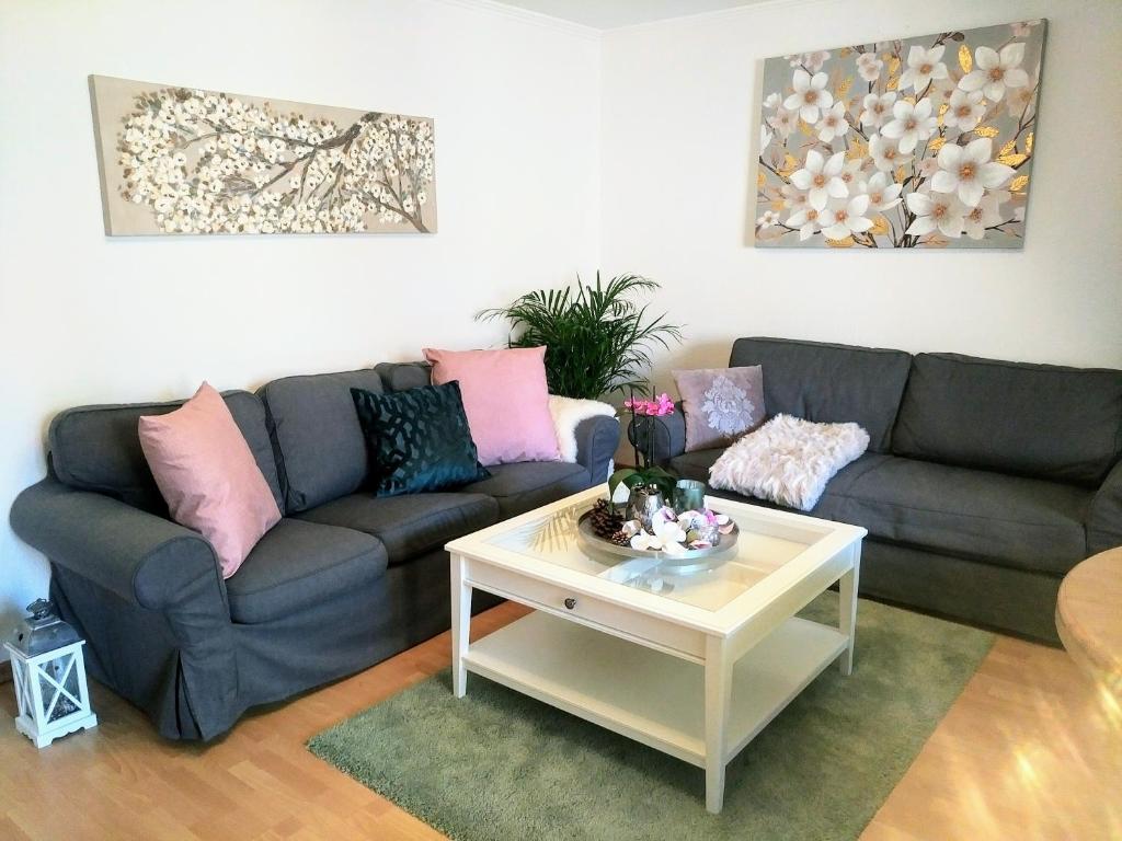 a living room with a couch and a coffee table at Ferienwohnung Nordwind in Flensburg