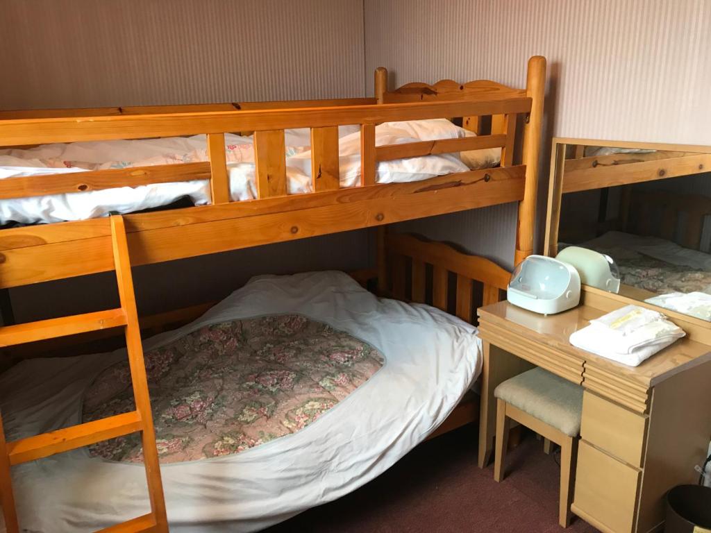Postel nebo postele na pokoji v ubytování Hotel Famitic Nikko Station
