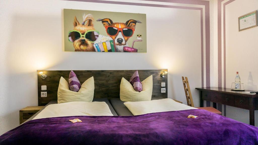 a bedroom with a purple bed with two dogs wearing sunglasses at Hotel Skada City Cölln in Cologne