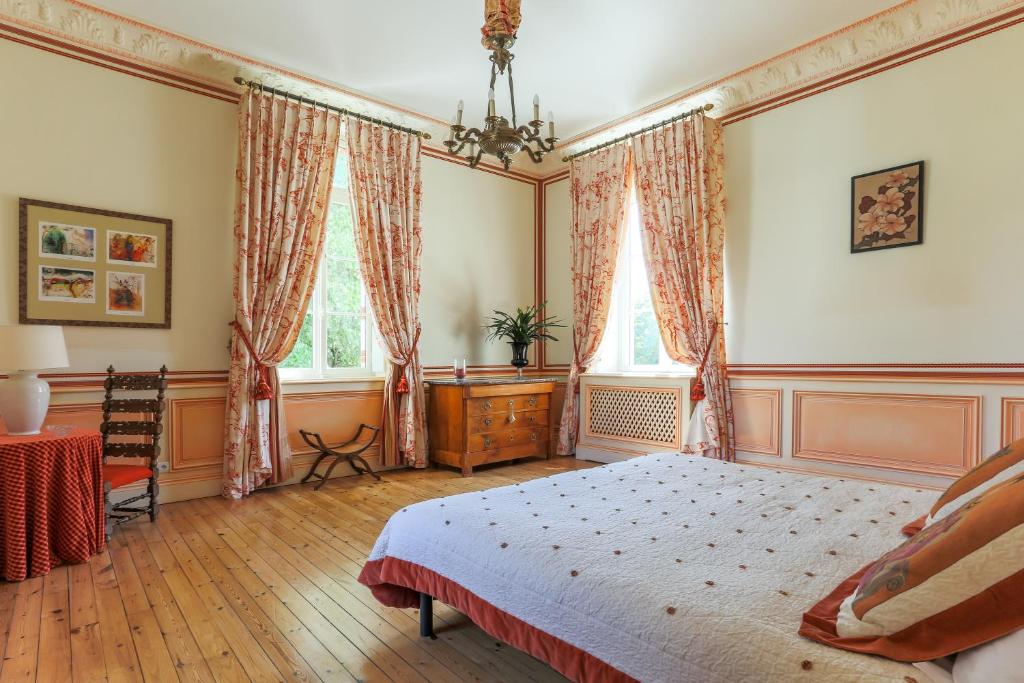 Postel nebo postele na pokoji v ubytování Domaine de Brou