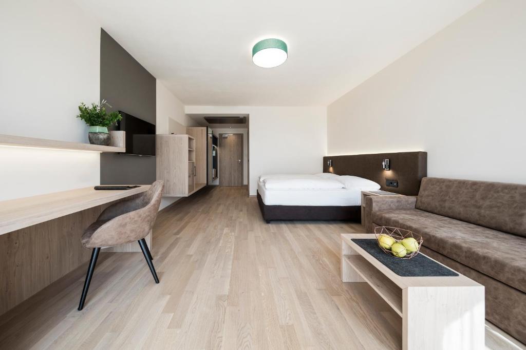 Postel nebo postele na pokoji v ubytování Hotel Torgglhof