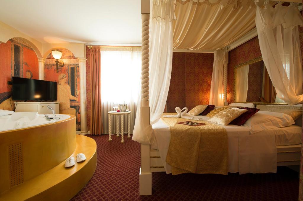 Postel nebo postele na pokoji v ubytování Hotel il Castelletto