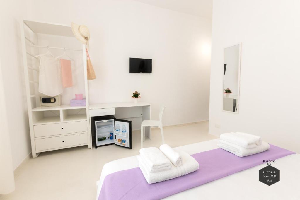 Postel nebo postele na pokoji v ubytování Hybla Major B&B