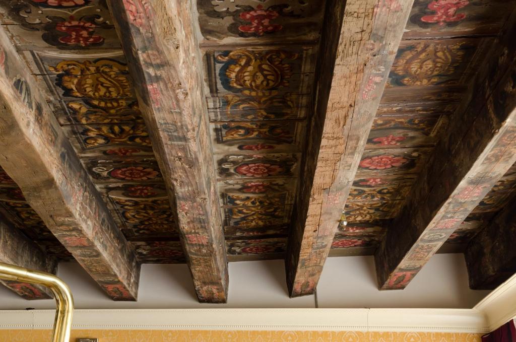 a coffered ceiling with paintings on it at Hotel Palazzo Giovanelli e Gran Canal in Venice