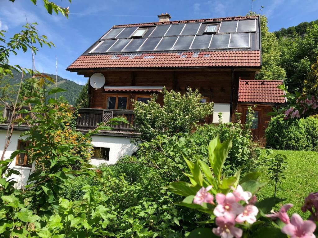 a house with solar panels on the roof at Ferienhaus Panorama in Bad Goisern