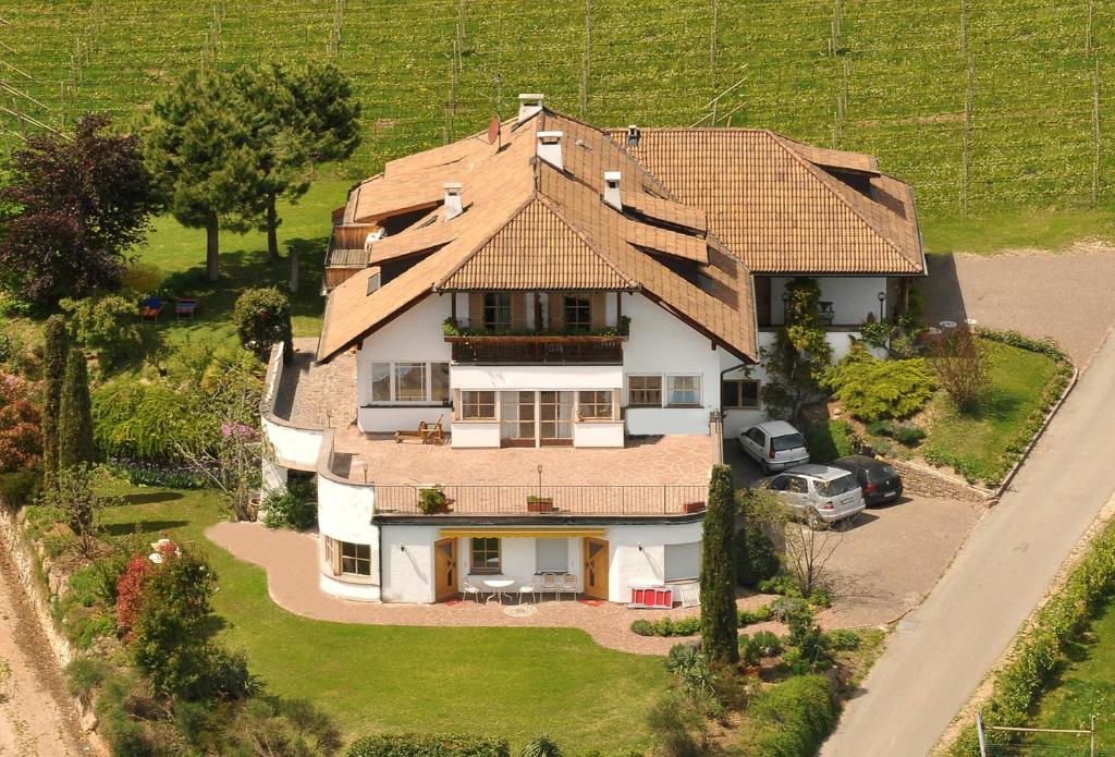 an aerial view of a house with a roof at Haus Romen in Appiano sulla Strada del Vino