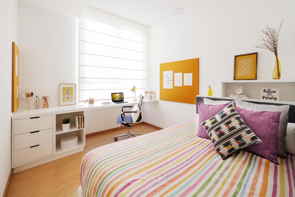 A bed or beds in a room at Camplus Pamplona