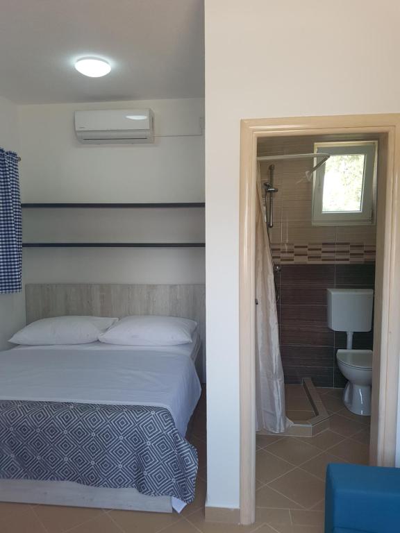 Posteľ alebo postele v izbe v ubytovaní Toni