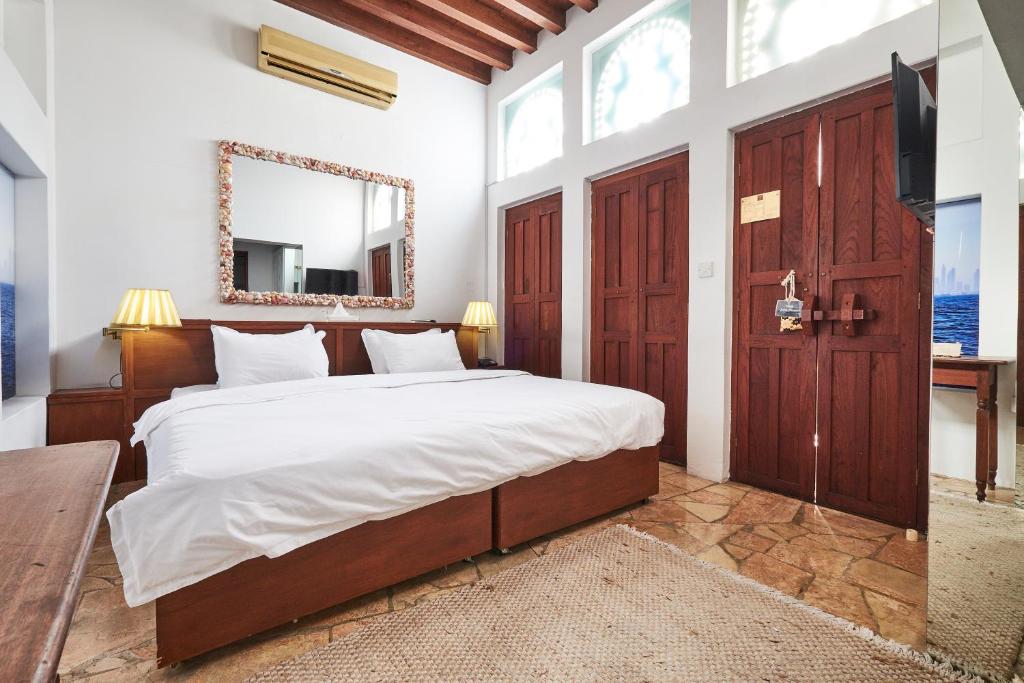 Ένα ή περισσότερα κρεβάτια σε δωμάτιο στο XVA Art Hotel