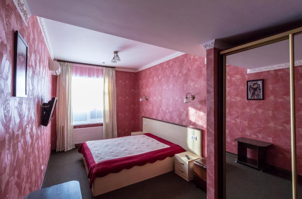 Postel nebo postele na pokoji v ubytování Hotel Т2