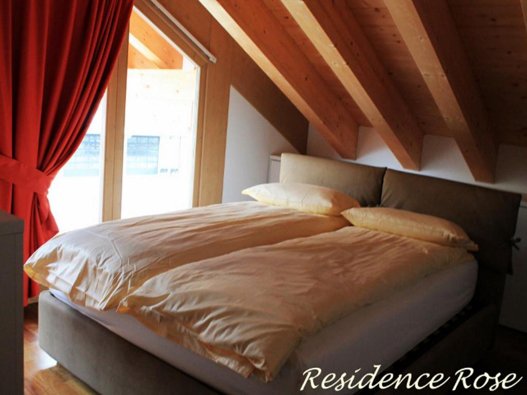Postel nebo postele na pokoji v ubytování Residence Rose
