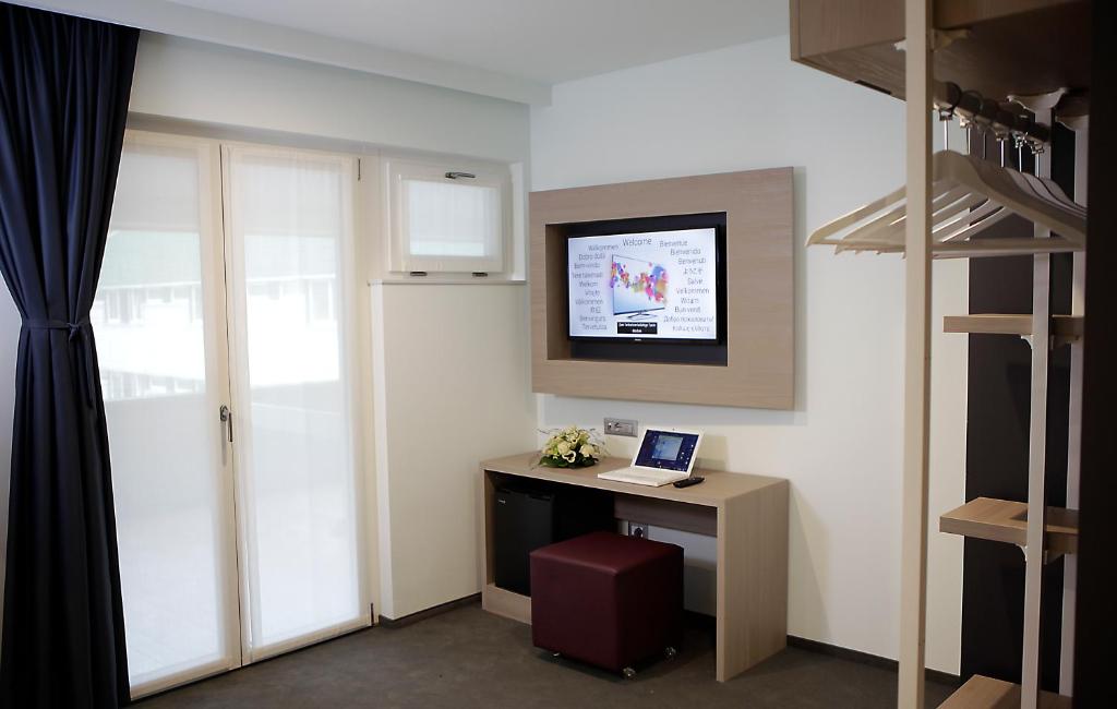 TV a/nebo společenská místnost v ubytování Hotel Carnia