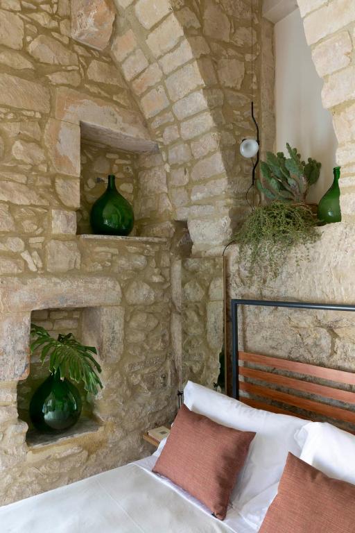 A bed or beds in a room at Casa Santa Maria - Fichi d'india