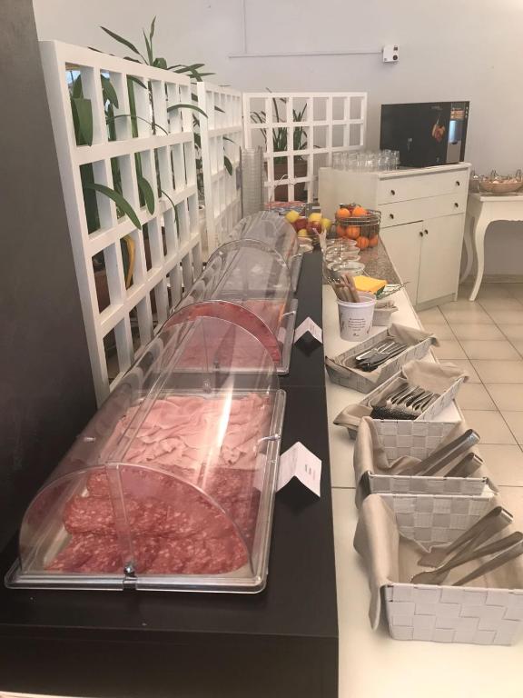 Postel nebo postele na pokoji v ubytování Hotel Smeraldo