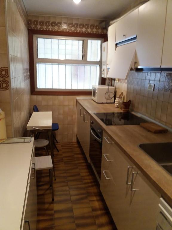 Kuchyň nebo kuchyňský kout v ubytování Acogedor Apartamento 2ª línea playa