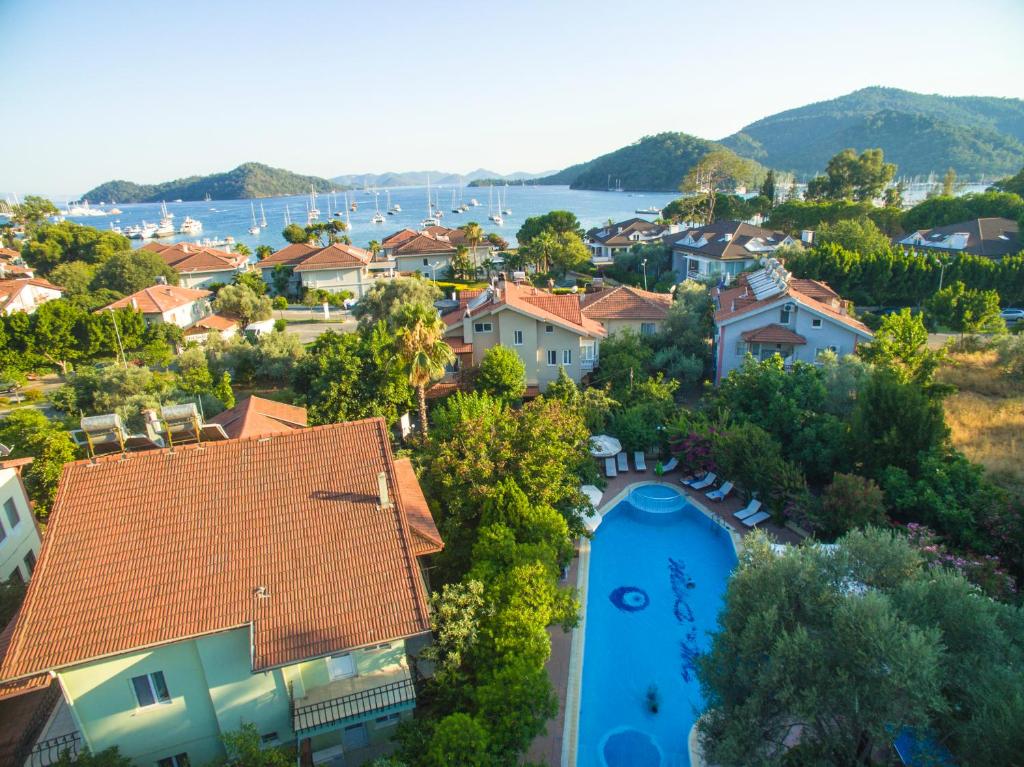 an aerial view of a residential neighborhood with a swimming pool at Mr. Dim Exclusive Apart Hotel in Göcek
