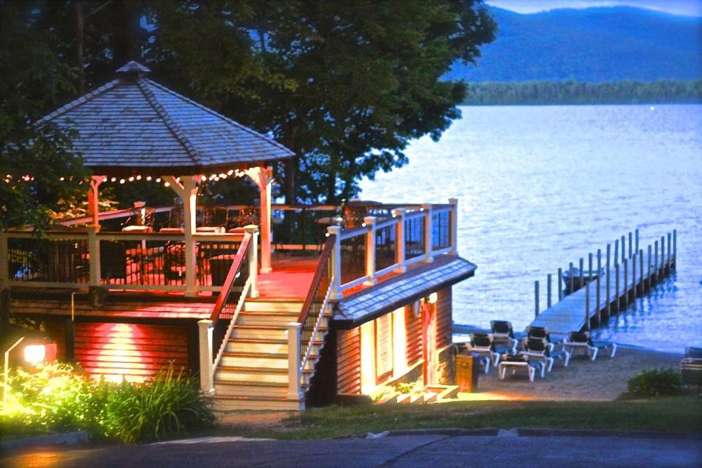 a dock with a gazebo next to the water at The Juliana Resort in Lake George