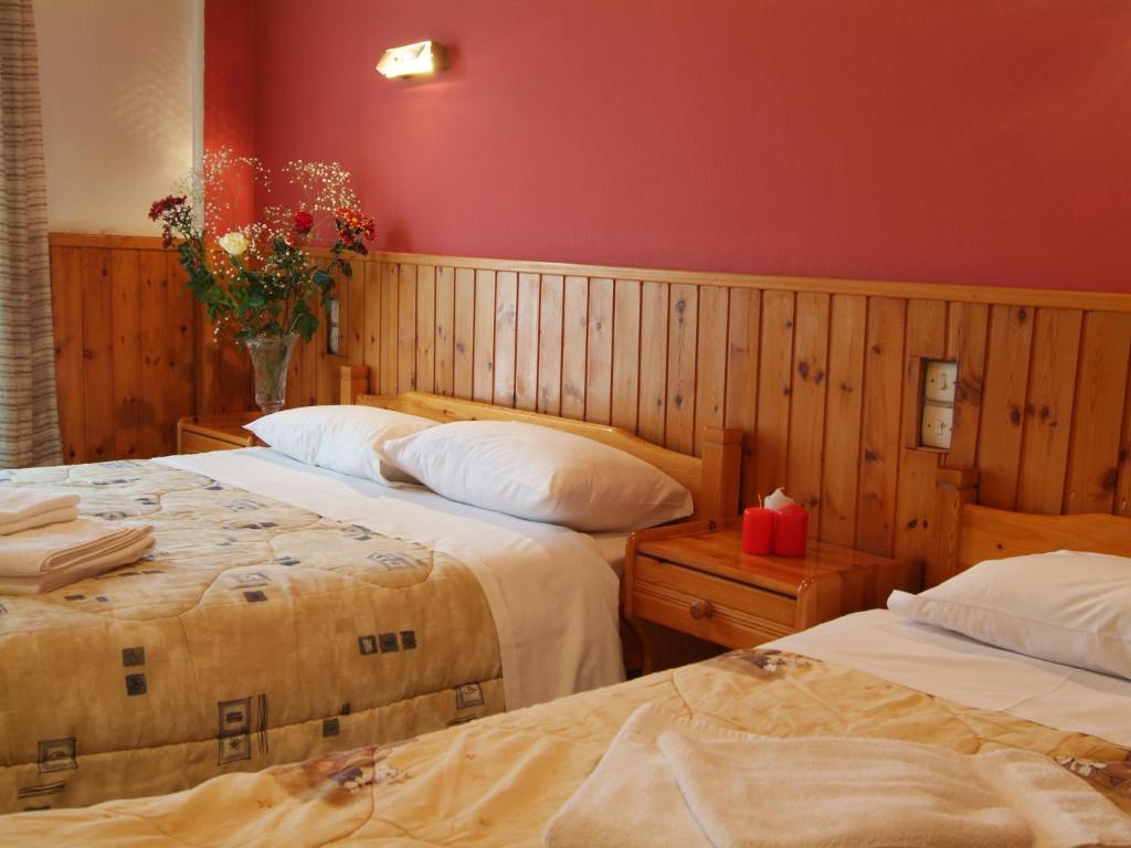 Postel nebo postele na pokoji v ubytování Hotel Athina
