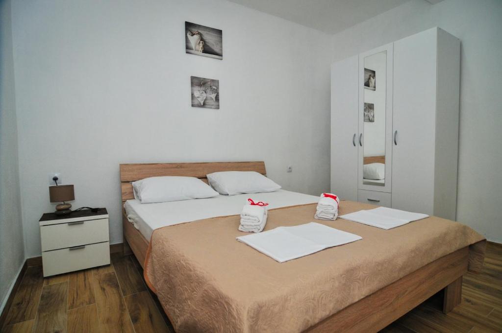Postel nebo postele na pokoji v ubytování Apartmani Bekonja