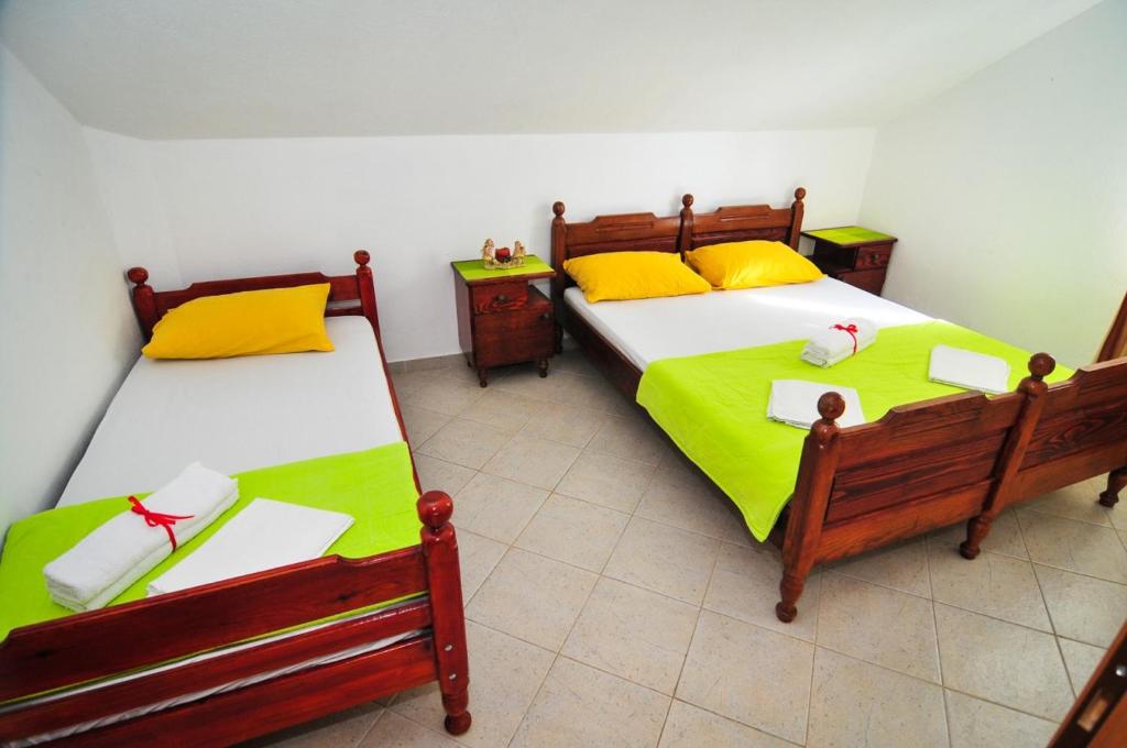 Postel nebo postele na pokoji v ubytování Apartmani Bekonja