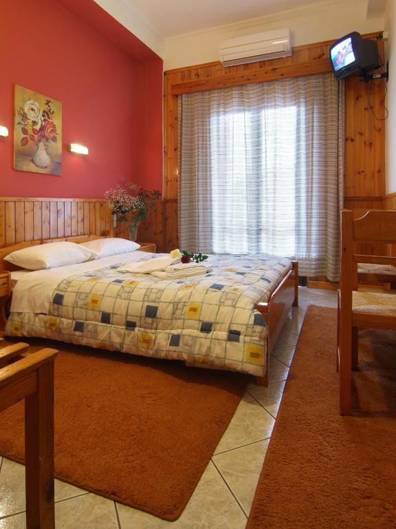 Postel nebo postele na pokoji v ubytování Hotel Athina