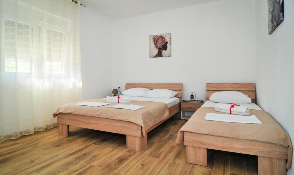 Postel nebo postele na pokoji v ubytování Apartmani Bekonja
