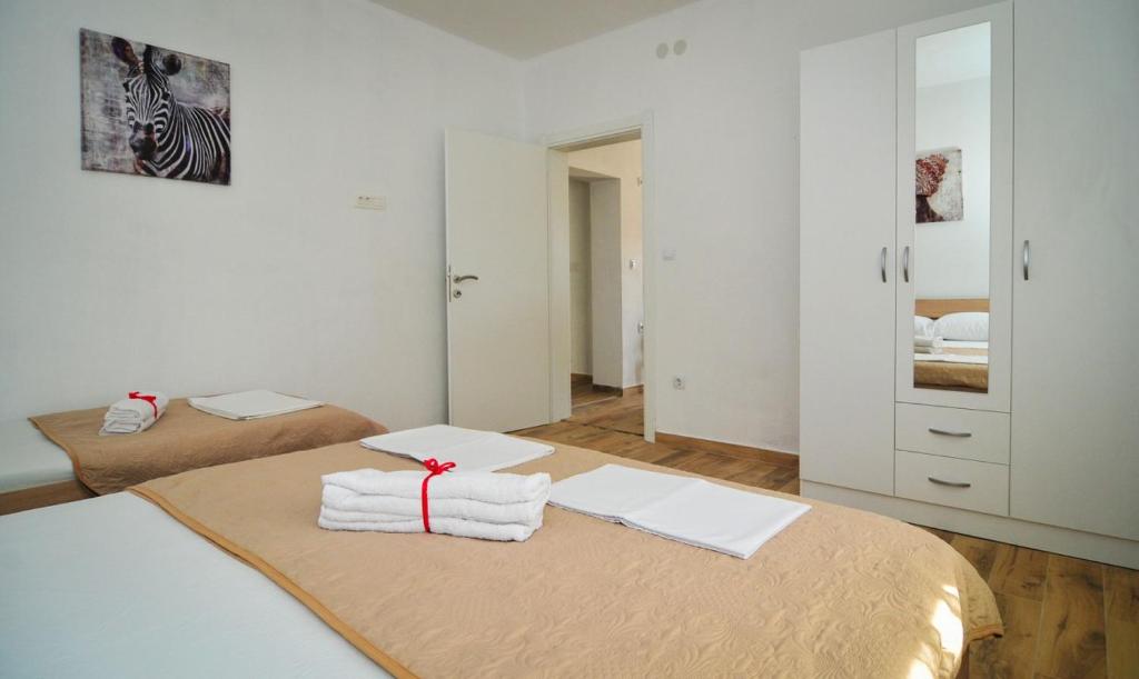 Postel nebo postele na pokoji v ubytování Apartmani Bekonja