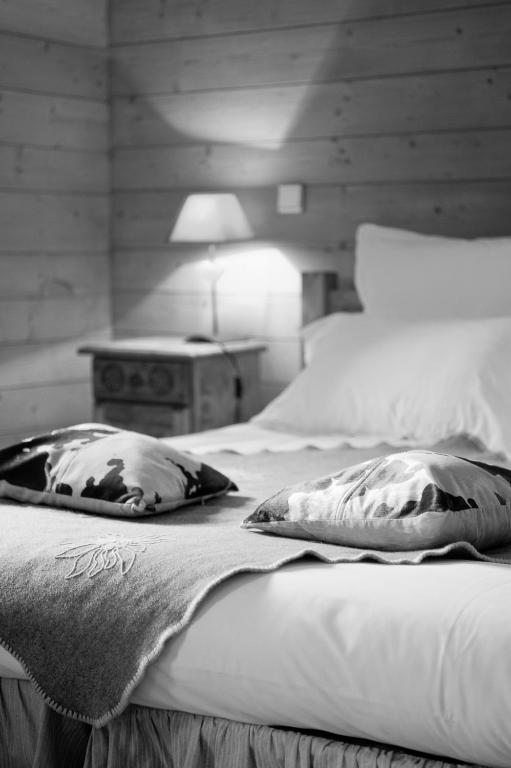 Postel nebo postele na pokoji v ubytování Alp'Hotel