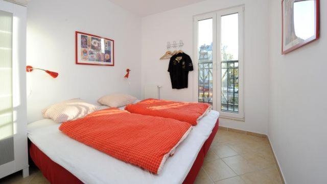 Łóżko lub łóżka w pokoju w obiekcie ApartNet Apartamenty przy Promenadzie
