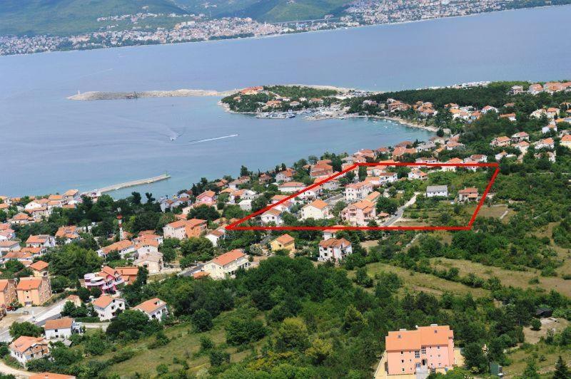an aerial view of a town with a large body of water at Apartments Silo in Šilo