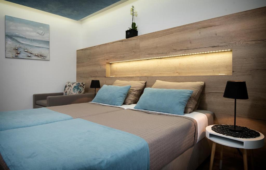 Postel nebo postele na pokoji v ubytování Guest House Laura