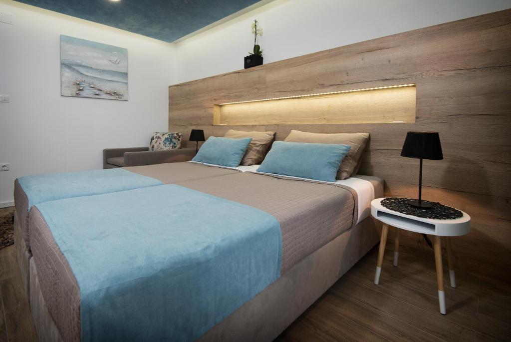 Postel nebo postele na pokoji v ubytování Guest House Laura