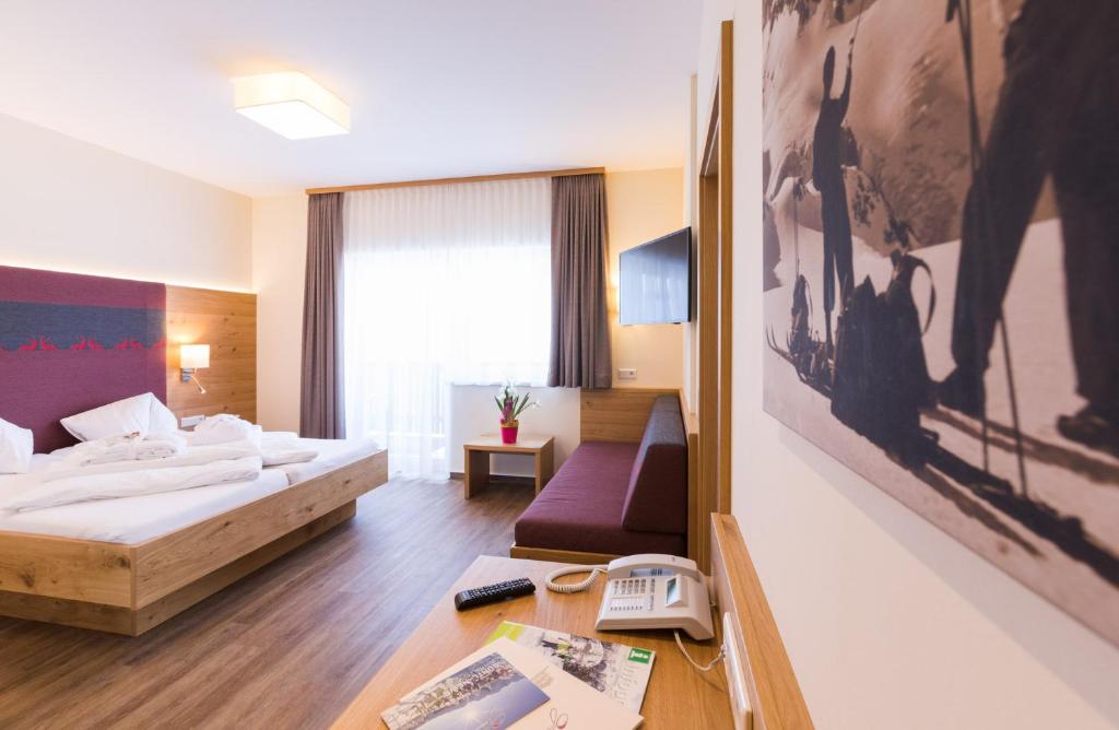 Postel nebo postele na pokoji v ubytování Panoramahotel Gürtl
