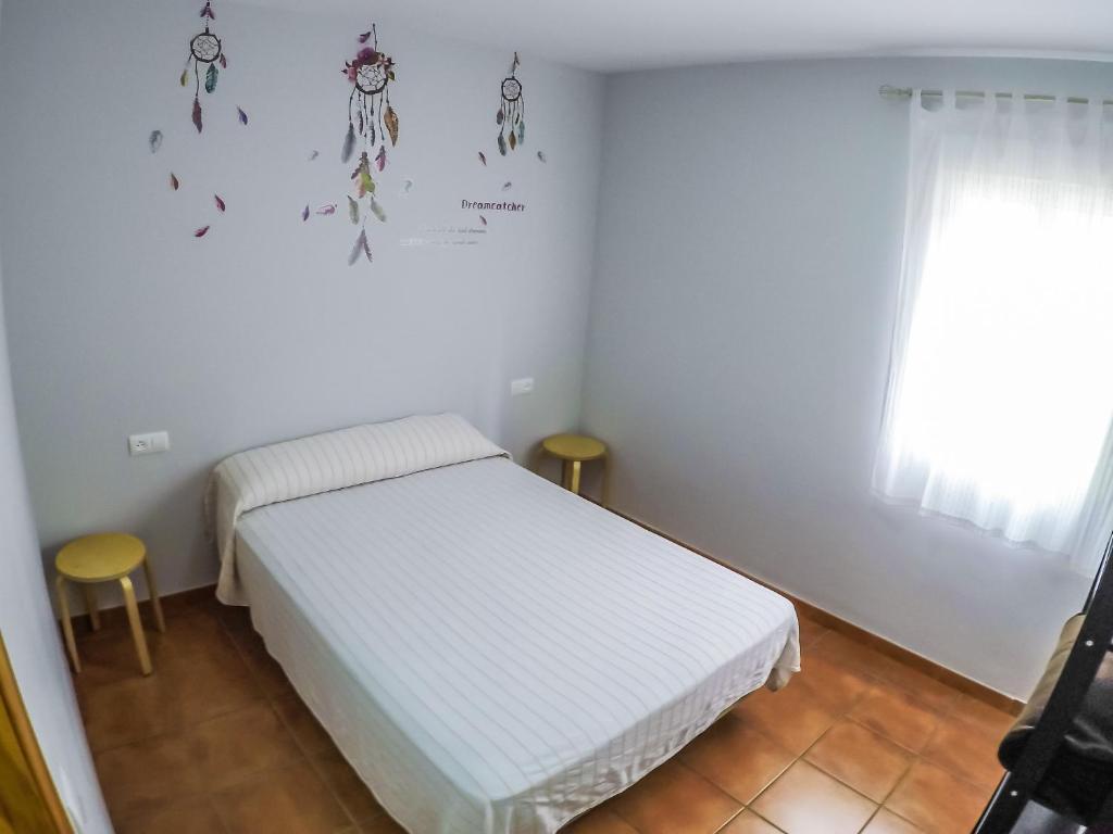 Postel nebo postele na pokoji v ubytování CENTRO DE OCIO ALÚA Bungalows Camping Rafting Benamejí