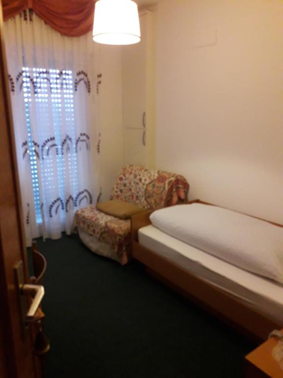 Postel nebo postele na pokoji v ubytování Hotel Lux