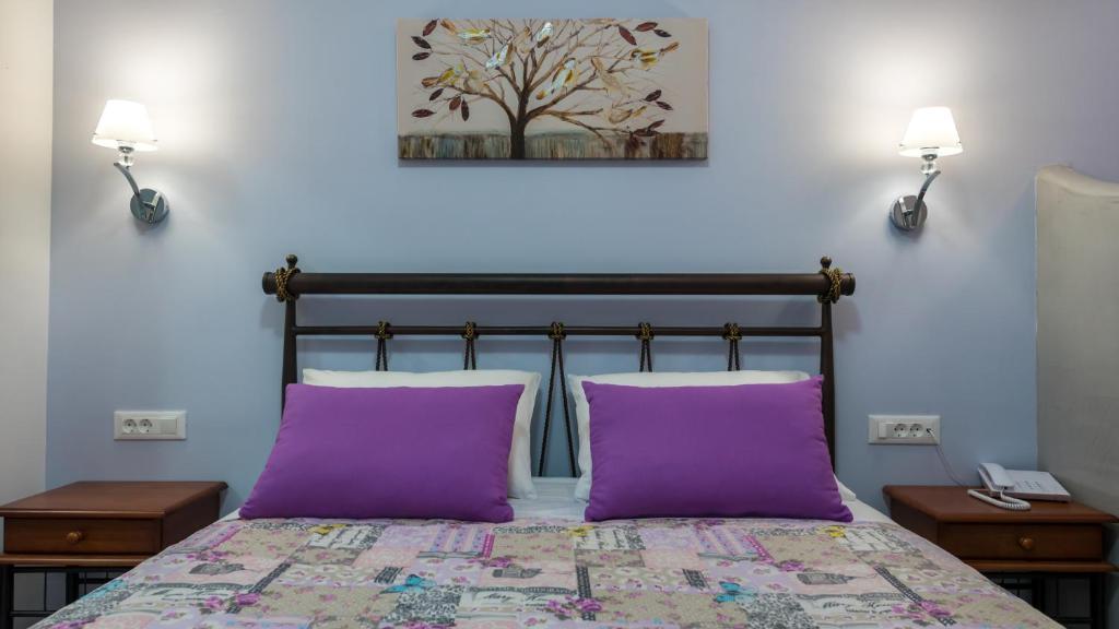 Postel nebo postele na pokoji v ubytování Akis Hotel