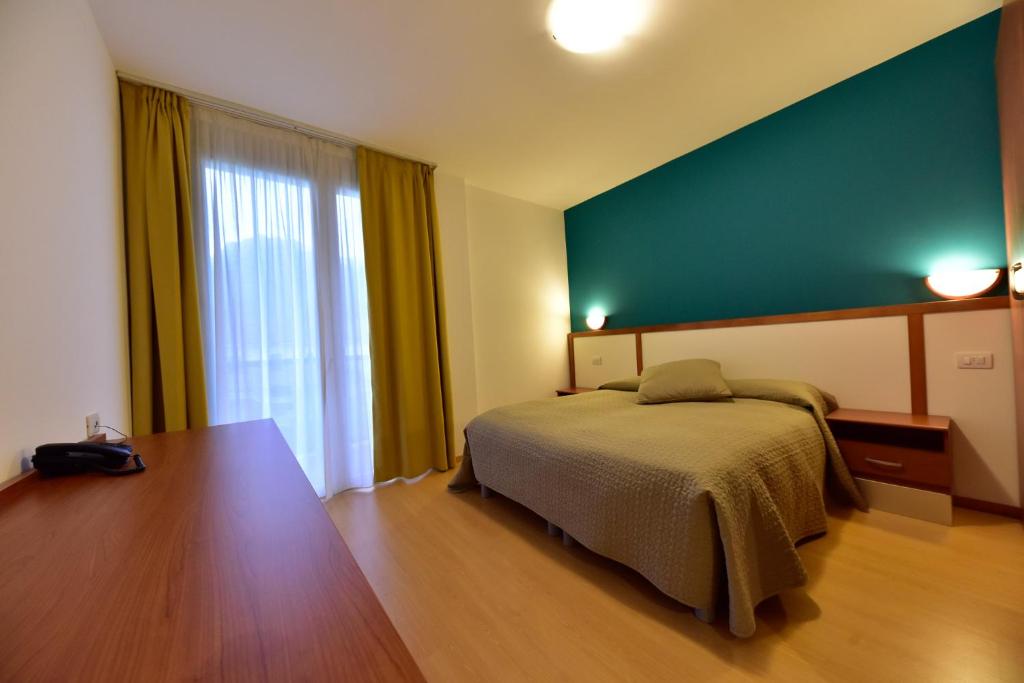 Postel nebo postele na pokoji v ubytování Hotel La Pieve