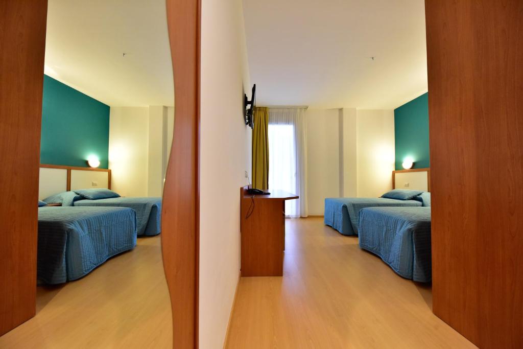 Postel nebo postele na pokoji v ubytování Hotel La Pieve
