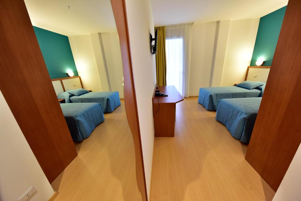 Postel nebo postele na pokoji v ubytování Hotel La Pieve