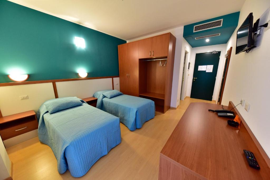 Postel nebo postele na pokoji v ubytování Hotel La Pieve