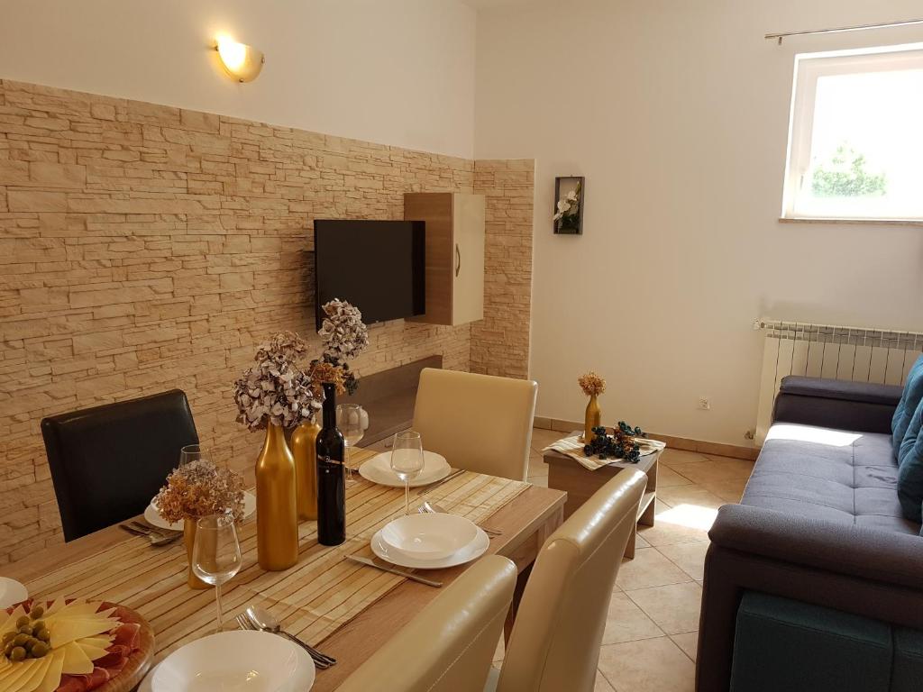 TV a/nebo společenská místnost v ubytování Apartment Taja