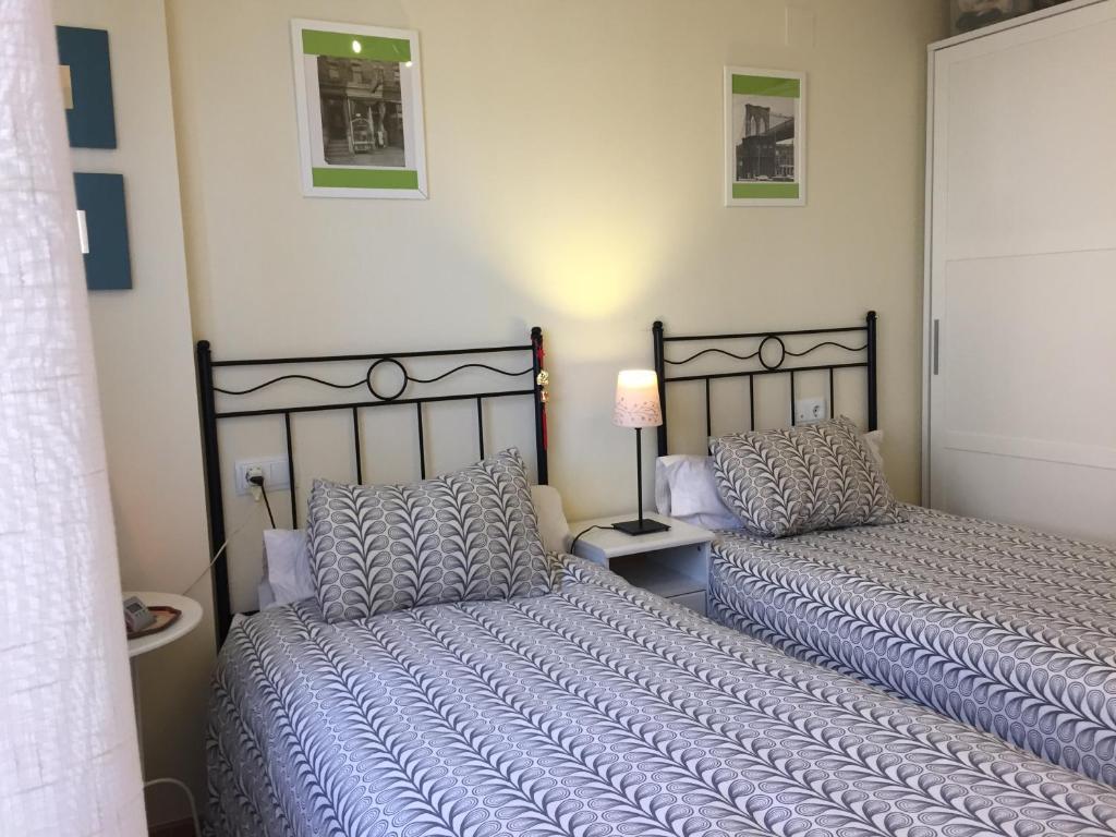 Postel nebo postele na pokoji v ubytování BIOK Ainsa Ordesa-Monte Perdido'