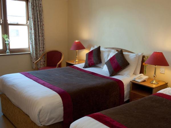 Letto o letti in una camera di Murphys of Killarney