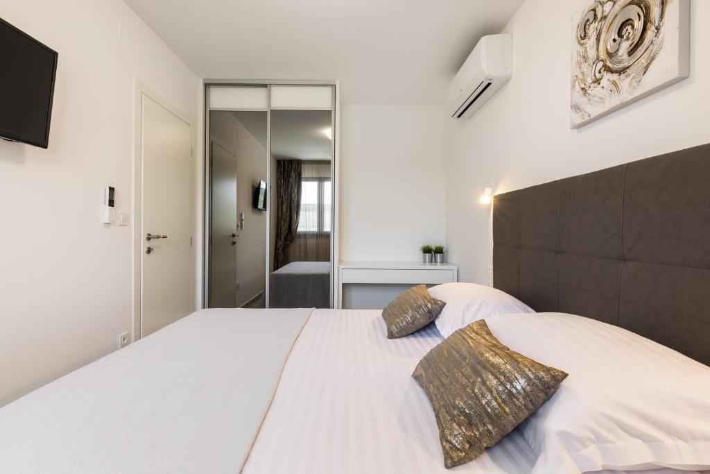 Posteľ alebo postele v izbe v ubytovaní Luxury Rooms Pino