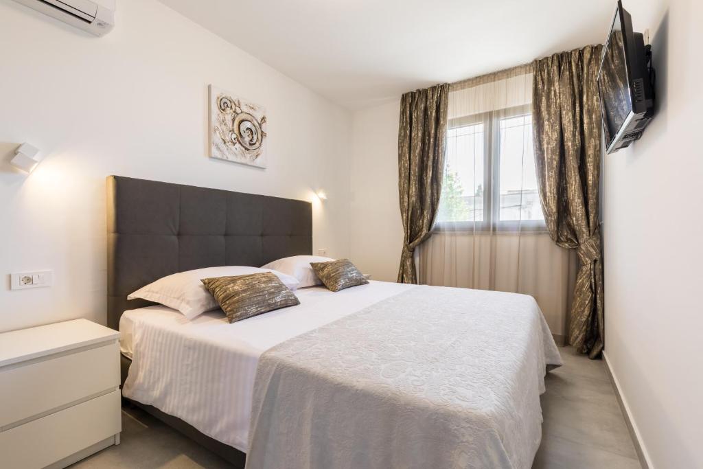 Posteľ alebo postele v izbe v ubytovaní Luxury Rooms Pino