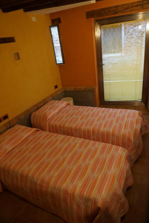 Postel nebo postele na pokoji v ubytování Casa delle gondole