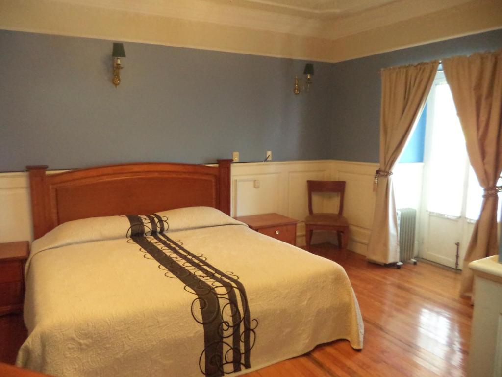Postel nebo postele na pokoji v ubytování Hotel Real Del Monte