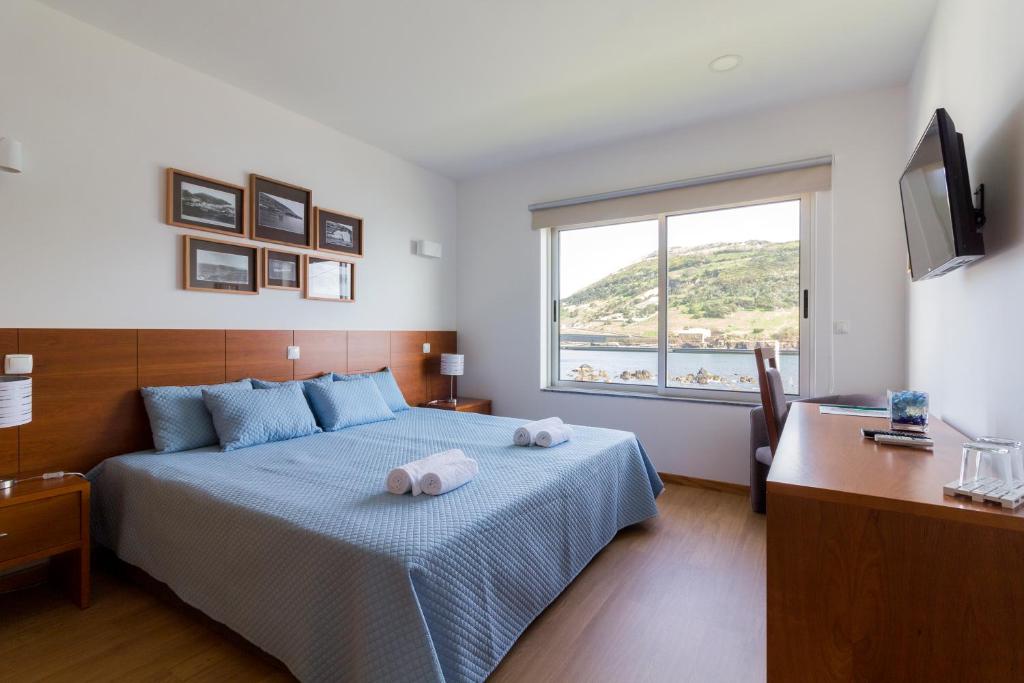 Postel nebo postele na pokoji v ubytování Monte da Guia